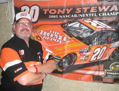 Bob Heiss NASCAR fan in front of Tony Stewart poster
