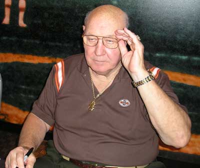 Bob Gain signing autographs at a Browns game